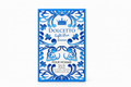 Dolcetto Light Blue Summer Pour Homme Eau de Parfum box, featuring a white background with intricate blue floral patterns and a blue crown logo at the top, wrapped in clear plastic at the top.